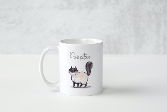 Tasse blanche avec un dessin de chat et le texte "Purr-fect".